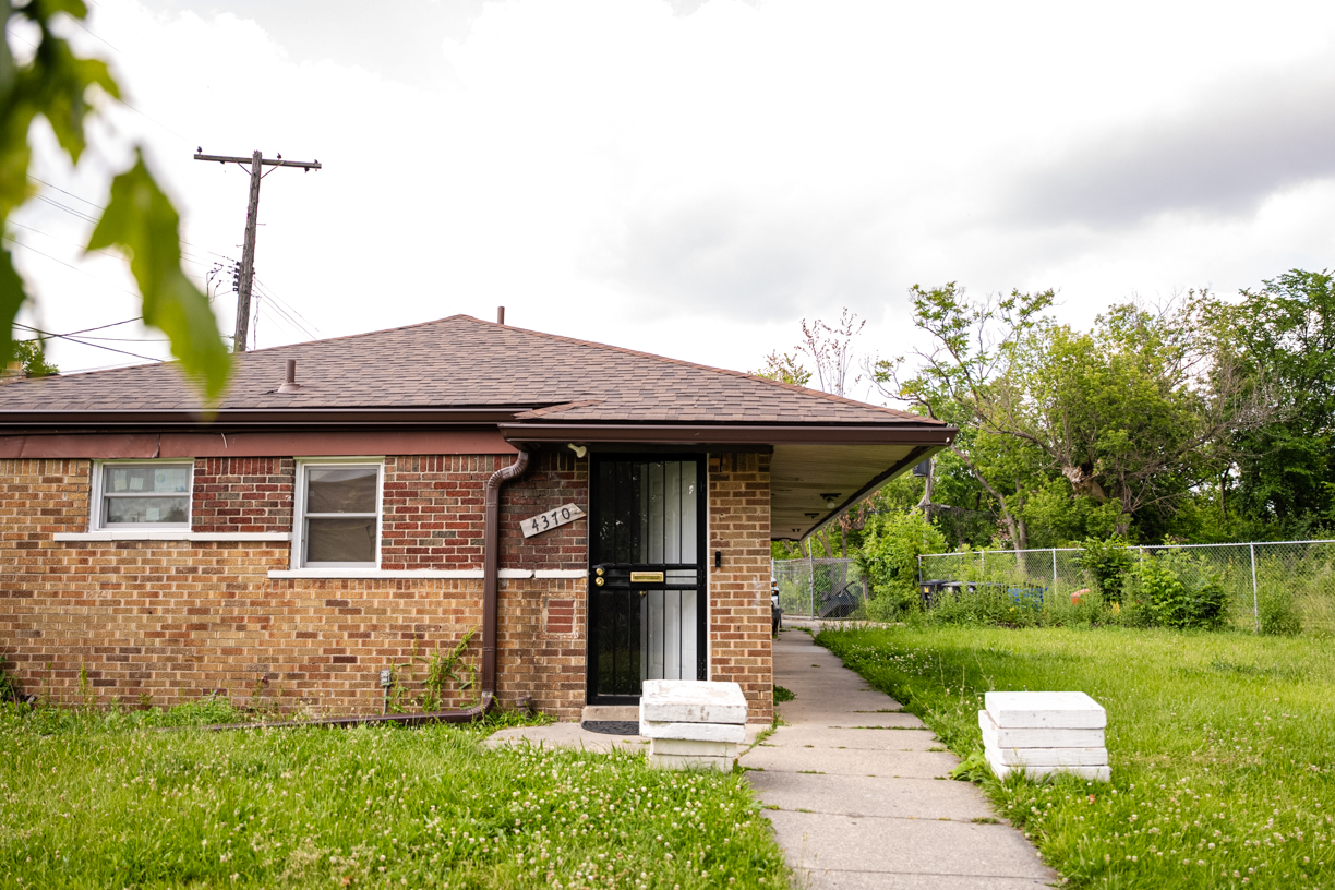 Exterior of apartment building with freshly mowed lawn